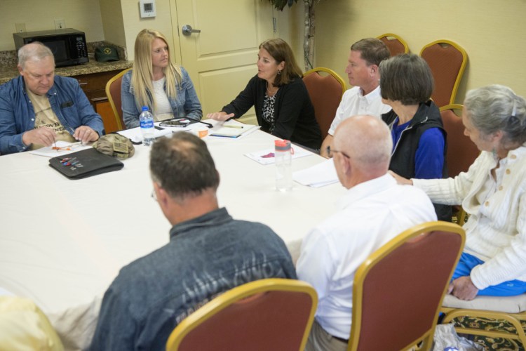 Heather Johnson, director of ConnectME, top center, talks on Thursday about how community leaders can prepare to apply for grant money to help fund broadband expansion in to rural areas at a Broadband Community Meeting at the Comfort Inn in Wilton. The discussion focused on the state's Broadband Action Plan, available planning grants, how to gauge community readiness, and funding mechanisms for broadband projects.