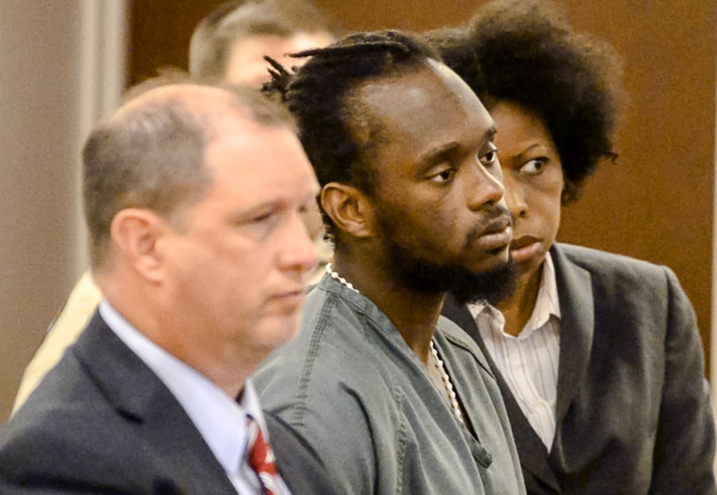 From left, Attorney Brad Grant, defendant Aubrey Armstrong and translator Tracy A. Johnson stand during Armstrong's sentencing hearing Friday at the Capital Judicial Center in Augusta. Armstrong was sentenced to 30 years in prison in connection with the killing of Joseph Marceau, of Augusta.