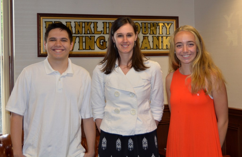 Scholarships were awarded to Mt Blue High School graduates Joseph Heath, left, and Rebecca Harmon, right, seen here with Franklin Savings Bank Treasurer Pam Dixon.