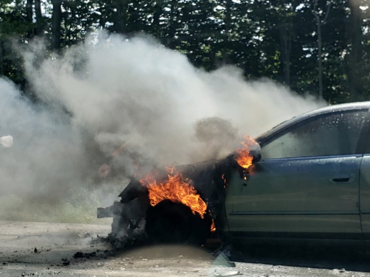 Waterville firefighters put out a fire that engulfed the engine of a car Friday in the northbound lanes of Interstate 95 near exit 27.