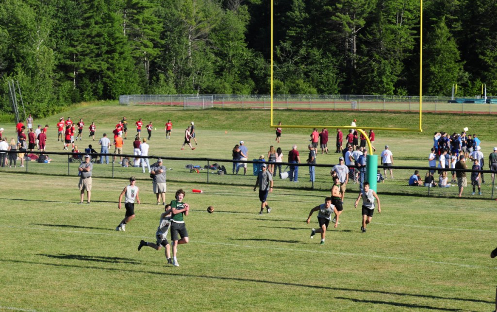 Leavitt and Winthrop/Monmouth play one of several games going on simultaneously on multiple fields during a 7x7 tournament Friday in Turner.