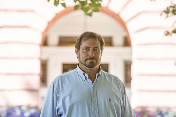 Mark Andre, the Republican candidate running against incumbent Democrat Colleen Madigan for the House 110 seat in the Legislature, poses for a portrait in front of Waterville City Hall on Wednesday. Madigan has received her initial allotment of Clean Elections funds. Andre has not.