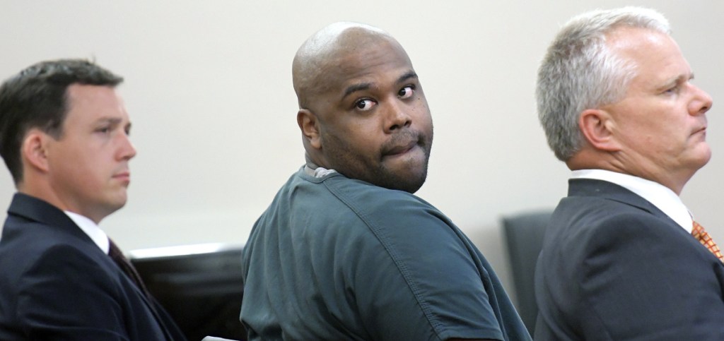 Flanked by his attorneys, Caleb Gannon, left, and Stephen Smith, Damik Davis listens Monday to relatives of Joseph Marceau describe their loss following his 2015 robbery and murder in Augusta. Davis was sentenced in Augusta for his role in the 2015 bludgeoning death.