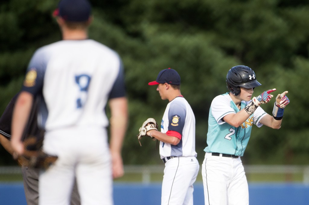Staff photo by Michael G. Seamans 
 Messalonskee's Carter Lambert (2) celebrates his double off Hampden in the Junior American Legion State Tournament on Tuesday at Mansfield Stadium in Bangor.