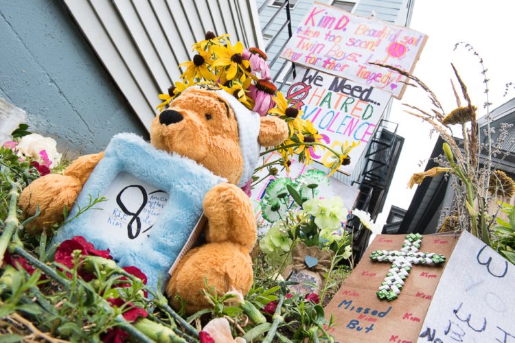 The small patch of grass next to where Kimberly Dobbie was killed Sunday morning on Sabattus Street in Lewiston is filled with messages and tokens of love.