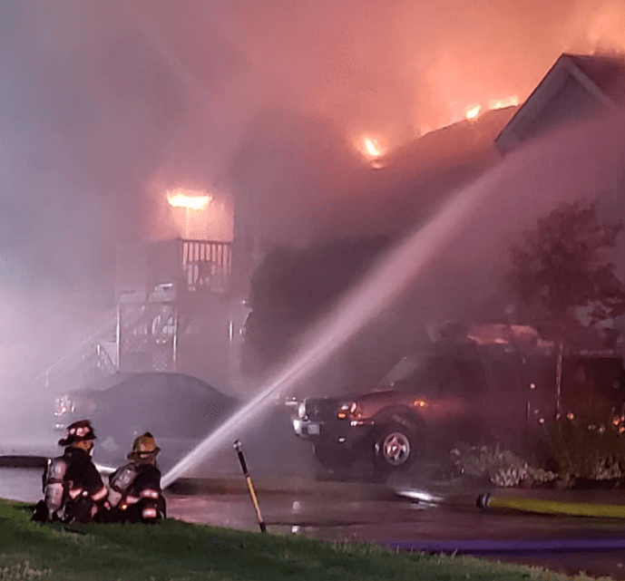 Firefighters battle a blaze engulfing an eight-unit condo building at 9 Cascade Road in Old Orchard Beach on Saturday night.