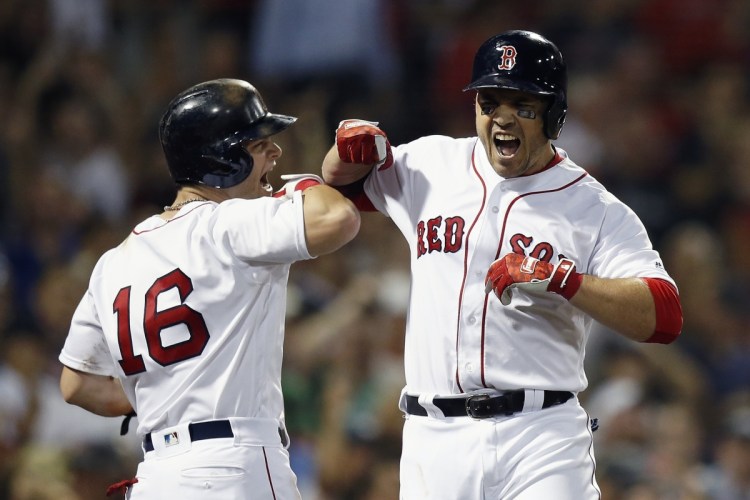 Steve Pearce celebrates his fourth-inning homer home run with Andrew Benintendi Thursday night in Boston. The Red Sox scored eight runs in the inning.
