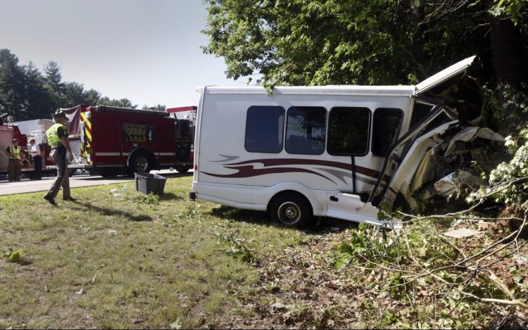 New Hampshire State Police investigate after a van crashed on Interstate 95 on Friday in Greenland, N.H. 