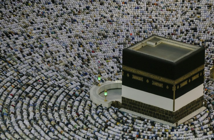 Muslim pilgrims pray at the Grand Mosque, ahead of the annual hajj  in the holy city of Mecca, Saudi Arabia, on Friday. The annual Islamic pilgrimage draws millions of visitors, making it the largest yearly gathering of people in the world.