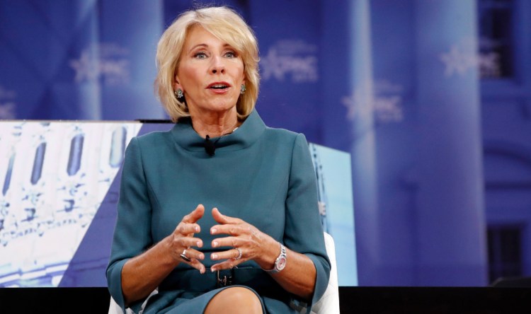 Education Secretary Betsy DeVos has hired several for-profit college insiders and frozen Obama-era rules.