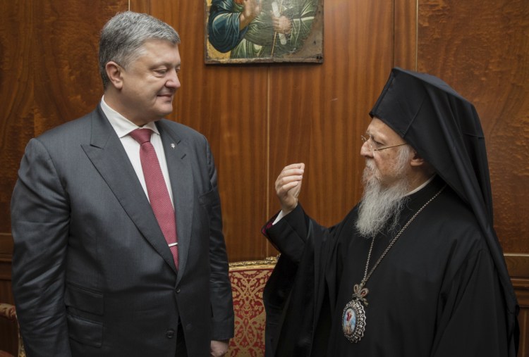 Ecumenical Patriarch Bartholomew I speaks with Ukrainian President Petro Poroshenko in Istanbul on April 9. Kiev and Moscow are wrestling over the religious fate of Ukraine.