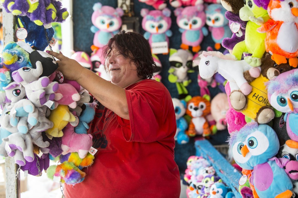 Kim Blanchard prepares her carnival game, Dakota's Root N' Toot-N Cork Gun Game, at the Skowhegan Fair Grounds for the 200th annual Skowhegan State Fair on Wednesday.