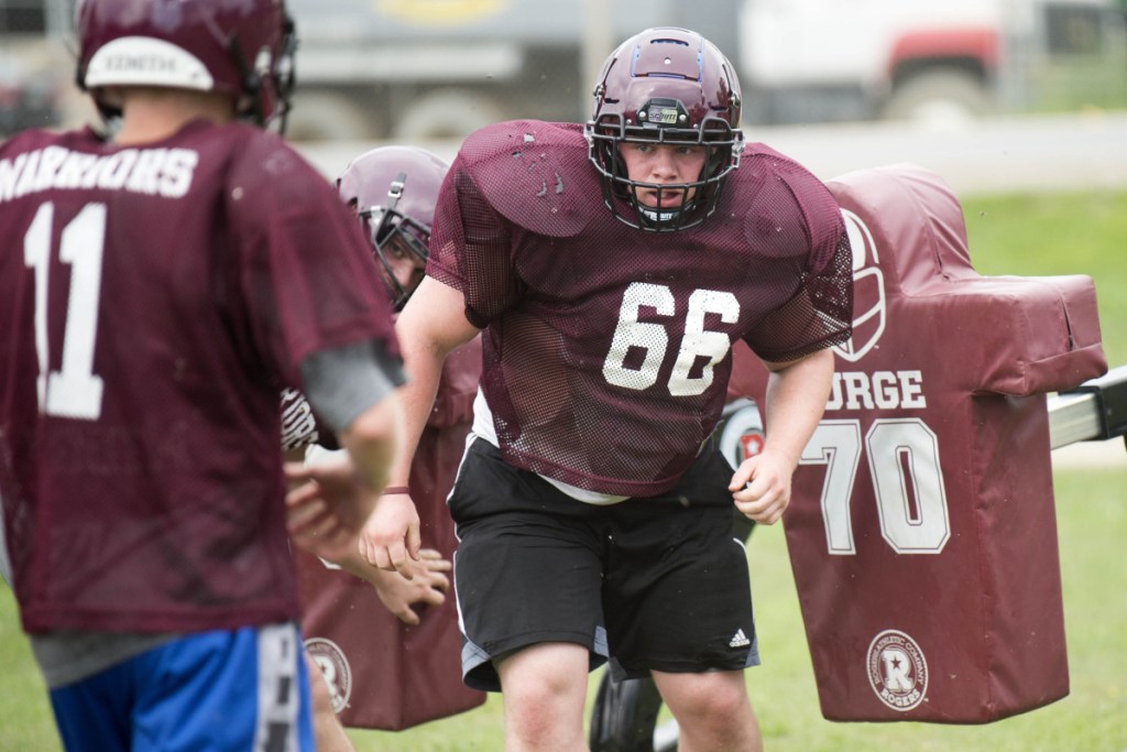 Staff photo by Michael G. Seamans 
 Nokomis' James Boyd (66) works on a drill during practice Wednesday in Newport.