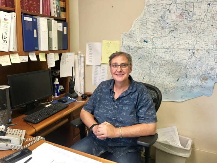 Oakland Town Manager Gary Bowman, pictured at his office on Friday, said he was under stress when he decided Wednesday to resign from the job, but took back the decision on Thursday.