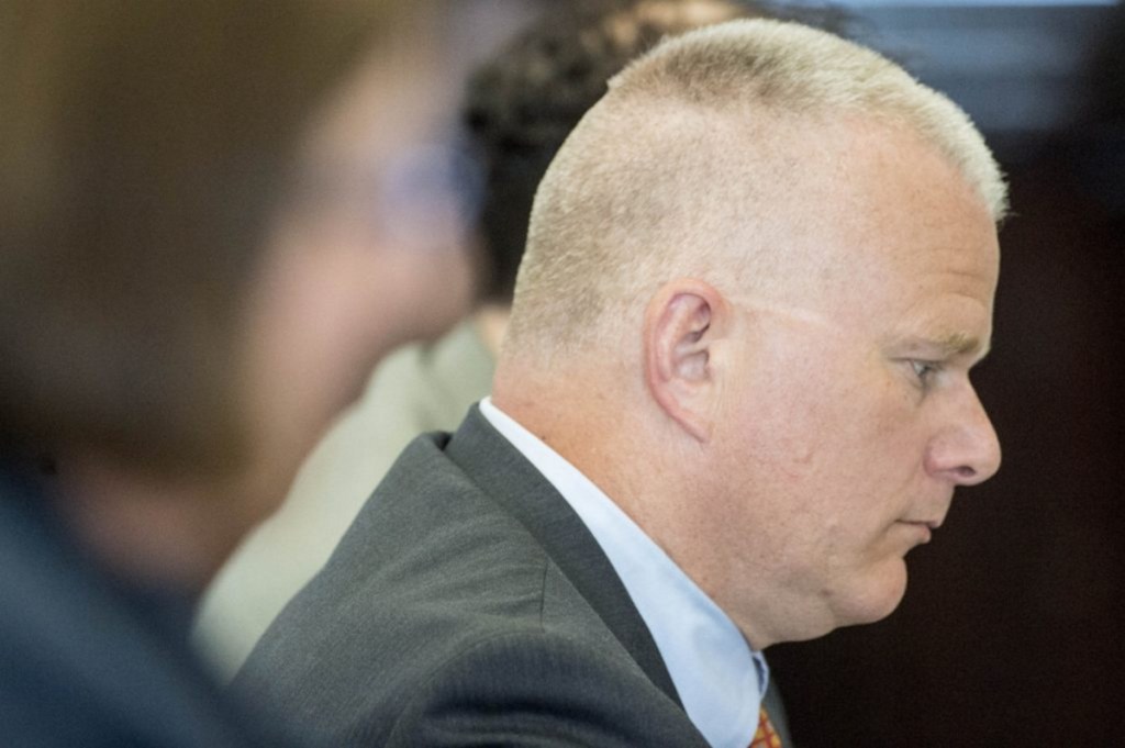 Defense attorney Stephen Smith sits with his client, Luc Tieman, during his sentencing for the murder of Tieman's wife, Valerie, at the Somerset County Court House in Skowhegan on May 11. "It is always a struggle to get enough jurors in some of the higher profile sex or murder cases," Smith said.