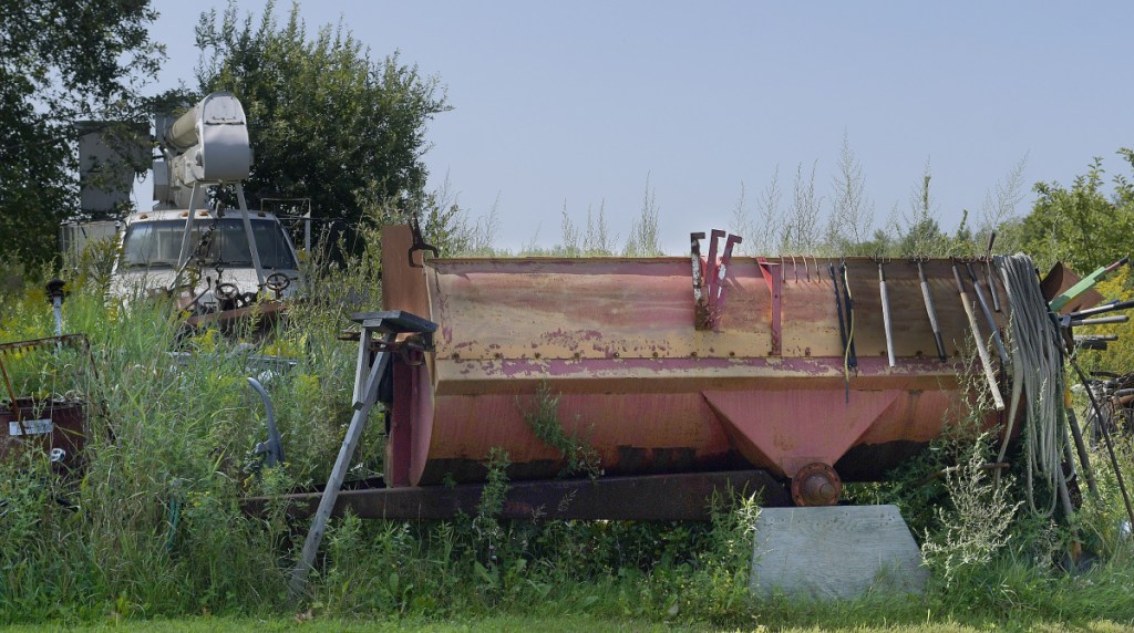 A variety of objects lie on the lawn Tuesday at a residence on Alexander Reed Road in Richmond. A court has ruled that the property is an illegal junkyard.