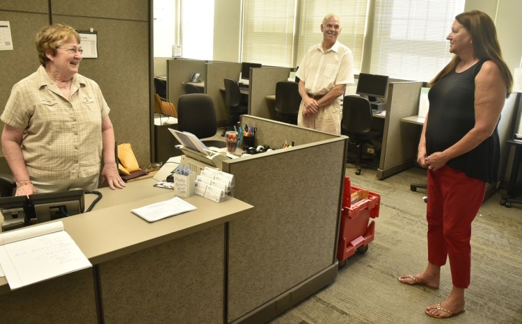 The Somerset Career Center has moved from Skowhegan into the Averill building on the Alfond Campus of Kennebec Valley Community College at Good Will-Hinckley in Fairfield, where it was open for business on Monday. Rita Chaykowsky, left, of the Associates for Training and Development agency, speaks with counselor Mike Shirley and Assistant Director Linda Price.