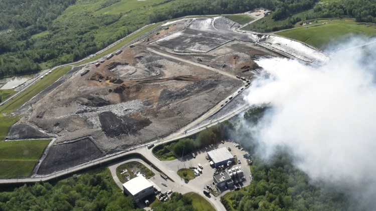 A huge, smoky fire burns as wind blows smoke for miles June 12 at the Crossroads Facility landfill in Norridgewock. The owner, Waste Management Disposal Services of Maine, Inc., is proposing to expand the landfill by 51 acres, increase its waste reduction and recycling programs and add a regional composting program. A public information meeting on the plan is scheduled for Thursday at Mill Stream Elementary School in Norridgewock.