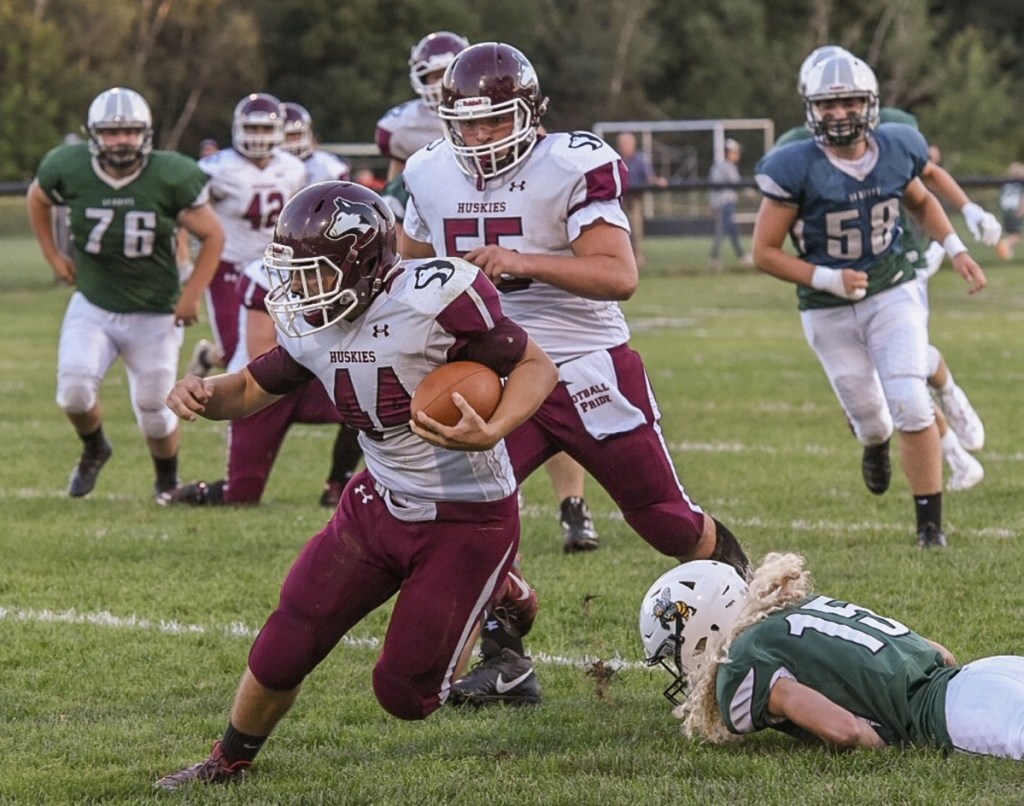 Maine Central Institute running back Kempton Roy carries the ball during the season opener against Leavitt in Turner.