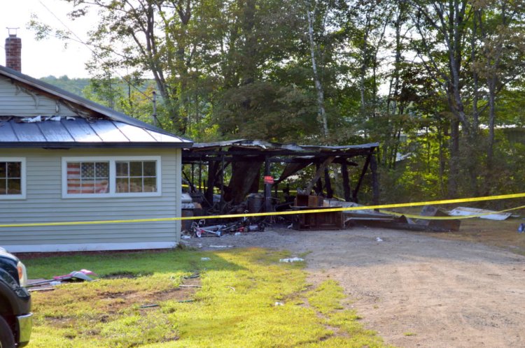 A fire destroyed a house and attached garage on Saturday night at 287 Middle St. in Farmington. John and Angela Whelpley and children escaped safely from the home, Farmington Fire Rescue Capt. Scott Baxter said Monday. The property is about 50 yards from the Regional School Unit 9 bus garage which can be seen through the trees on right. 