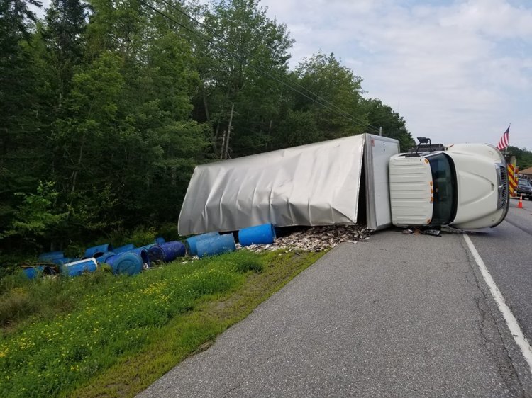 A bait truck overturned in Newcastle on Thursday, spilling its load of fish onto Route 1.