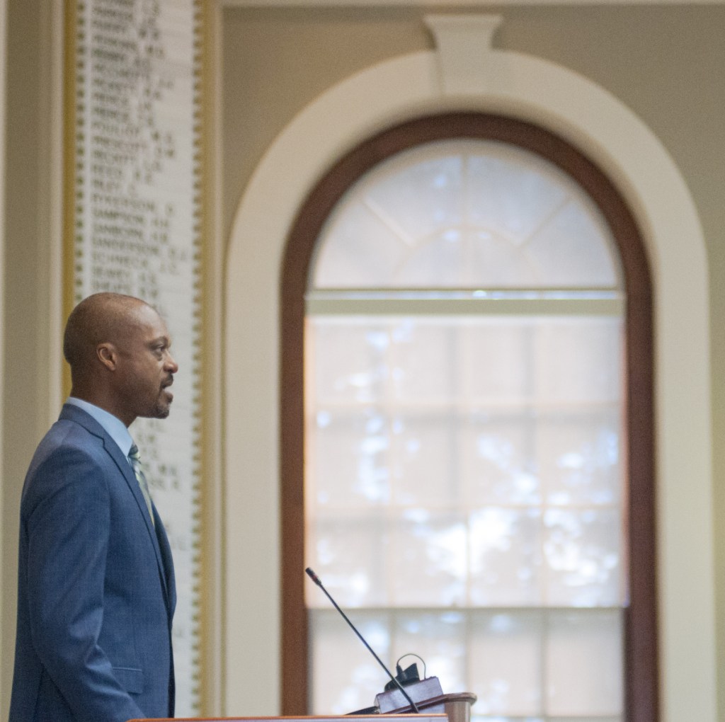 Rep. Craig Hickman, D-Winthrop, sings the National Anthem to open the House session on Thursday at the Maine State House in Augusta. Hickman included the 23rd Psalm as part of his opening prayer.