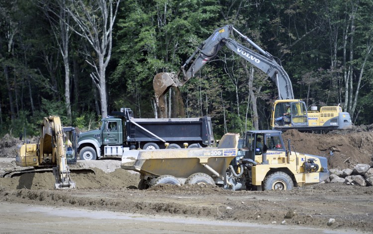 McGee Construction performs site work at the future school in Monmouth on Wednesday. As RSU 2 builds a new middle-elementary school in Monmouth, it has had to work with the Maine DEP to remediate non-natural levels of arsenic that were found on the site and likely related to pesticides used on an apple orchard that used to be there. The contractors have buried the soil containing arsenic about 7.5 feet under what will eventually be an athletic field, and state environmental officials say that it should remain contained there.