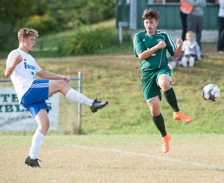 Winthrop's Adam Hardy tries to block a shot by Mountain Valley's Will Sorensen during Thursday's game in Winthrop.