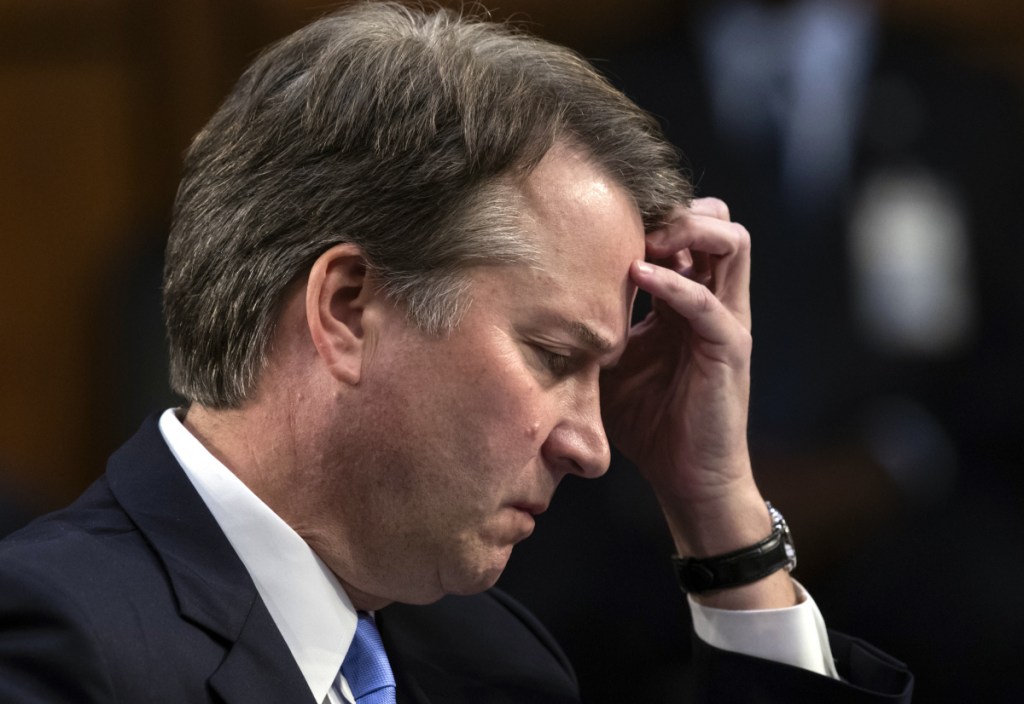 Brett Kavanaugh waits to testify before the Senate Judiciary Committee on Capitol Hill.