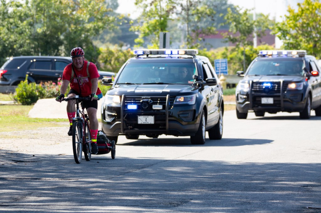 Brian McCarthy, a South Portland Police Officer, rounds the last corner in his seven-day, 360-mile ride from Houlton to South Portland to raise money for the Family Readiness Group of the 488th Military Police Company of the Maine Army National Guard located in Waterville. McCarthy recently retired from that unit as a Sergeant First Class and took a week of vacation to raise money to support the families of his former unit.