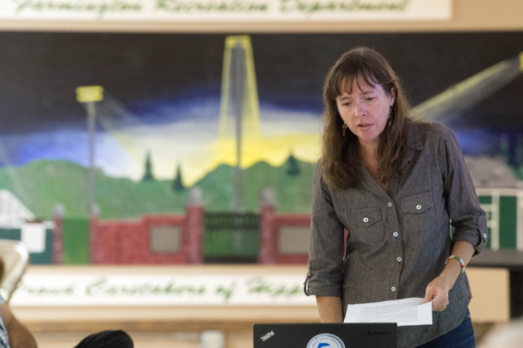 Catherine Schmitt, communications director at Maine Sea Grant, gives a presentation Wednesday at the Farmington Community Center on the proposed removal of Walton's Mill Pond Dam in Farmington.