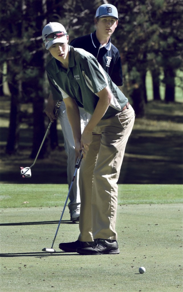 Staff photo by David Leaming 
 Winthrop's Zach Pray watches his put during the Mountain Valley Conference championships Thursday at Natanis Golf Course in Vassalboro.