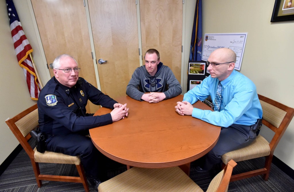 Joe Massey, Waterville's police chief, left, talks with Chase Fabian, Project Hope coordinator, center, and Deputy Chief Bill Bonney about the area's opioid troubles at the Waterville Police Department on Feb. 21, 2017. Bonney plans to embark on a 10-week course for law enforcement executives on Monday at the FBI National Academy in Quantico, Virginia.