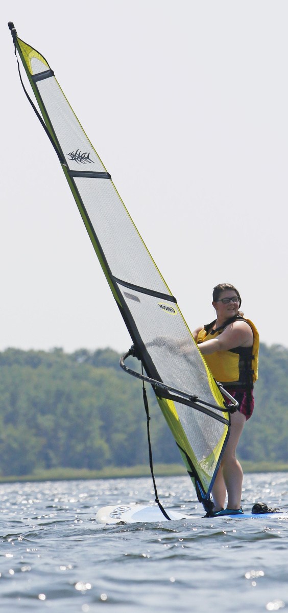 Brook Begin of Lewiston cruises on Lake Androscoggin last month  during a windsurfing lesson with Ian Barclay of Windsurfing-Maine. 