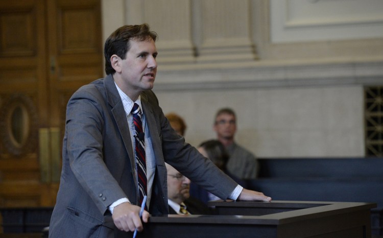 Attorney Jeremy Pratt speaks on behalf of his client, Robert Burton, in front of the Maine Supreme Judicial Court on Wednesday at the Cumberland County Courthouse in Portland.