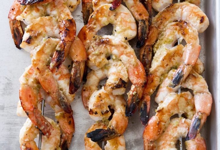 Use pureed jalapeños, garlic, cumin, and cayenne for a marinade and sprinkle with sugar on top to promote browning.