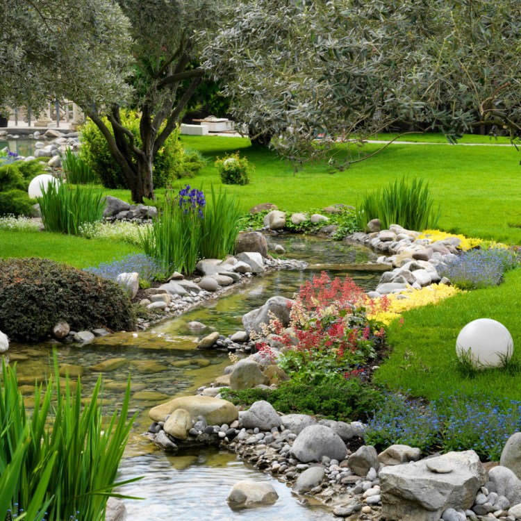 Part of this large Japanese garden contains a pond, above. Using rocks and native plants and pruning for special effects can help Maine gardeners create their own take on a Japanese garden.