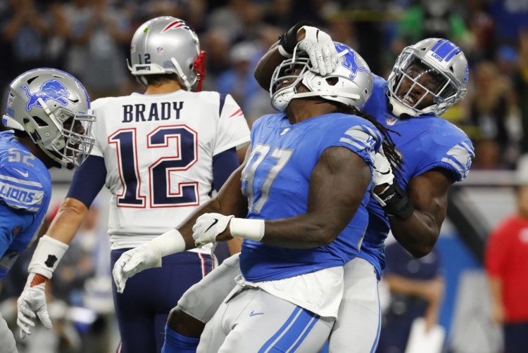Detroit Lions linebacker Jarrad Davis, right, celebrates with defensive tackle Ricky Jean Francois, after a tackle during the first half of the Lions' 26-10 win over the Patriots on Sunday night in Detroit.