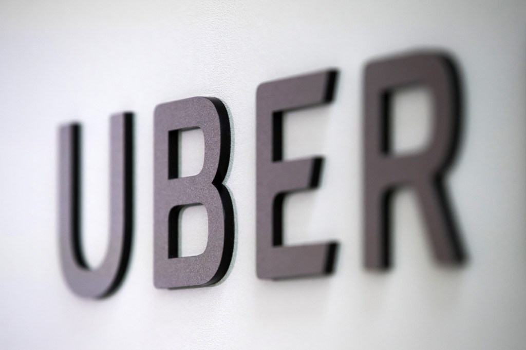 A sign marks a pick-up point for the Uber car service at LaGuardia Airport in New York in 2017.