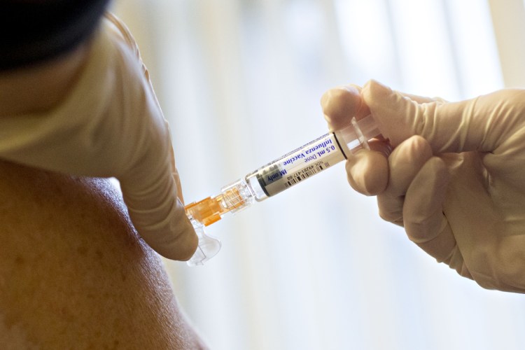 A nurse administers a flu shot, manufactured by Sanofi Pasteur, at Perry Memorial Hospital in Princeton, Ill. Bloomberg/Daniel Acker