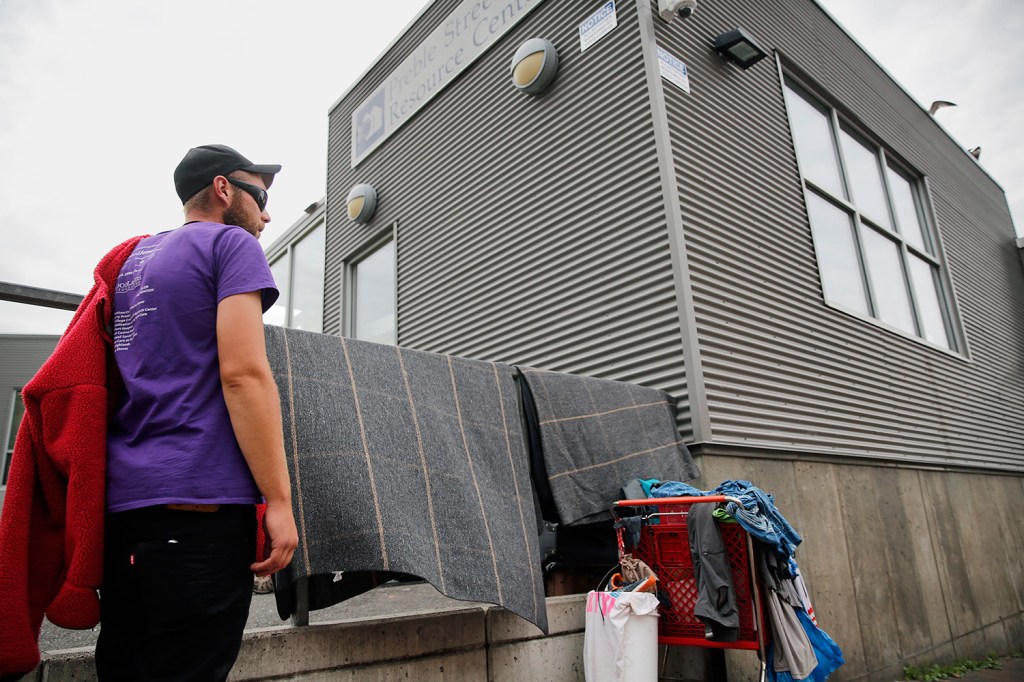 Dane Christan, who is homeless, stands outside the Preble Street Resource Center in September. 