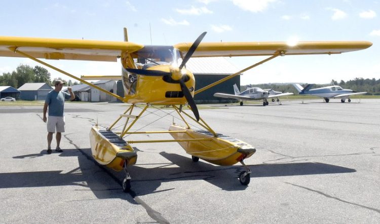 Pilot Mark Robidoux inspects his plane before taking off Wednesday from Central Maine Regional Airport in Norridgewock. Robidoux said he has not experienced problems with birds that might be attracted to the nearby Waste Management Crossroads Landfill.