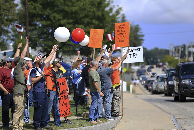 A large group of gun rights advocates gathered  Saturday show support for the Kittery Trading Post  as the Resistance Seacoast group held a protest in front of the sporting goods store. 