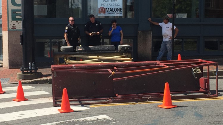 A worker was injured in Portland’s Old Port on Tuesday morning when he was standing on an elevated scissor lift that fell over onto Center Street