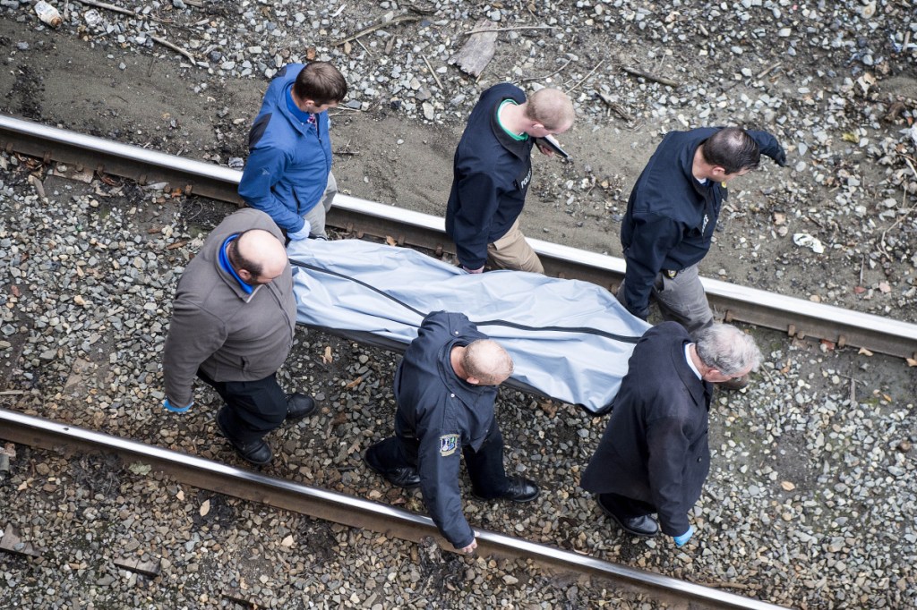 The body of a man found dead Thursday near railroad tracks under the North Street overpass in Waterville is removed. Police said they do not suspect foul play and will not know the cause of death until the medical examiner releases the results of an autopsy.