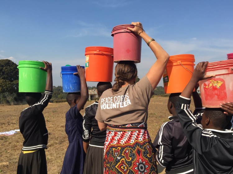 Elizabeth Ferry, of Winslow, is seen working with the Peace Corps in Tanzania.