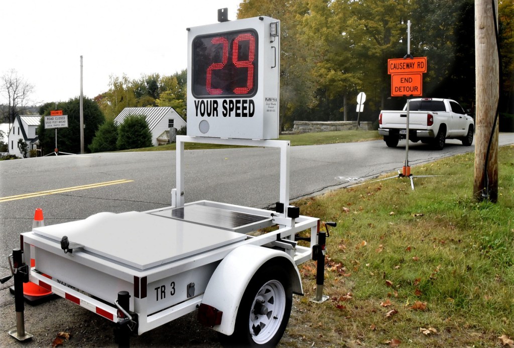 A portable radar unit clocks speed of a motorist at the intersection of the closed Causeway Road and Main Street in China on Tuesday.