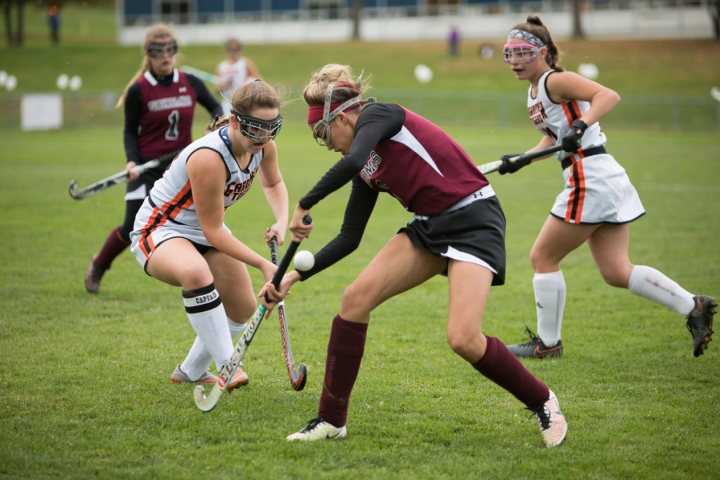 Photo by Jennifer Bechard 
 Nokomis' Alexys Dow and Gardiner's Jillian Bisson battle for the ball during a Class B North quarterfinal game Wednesday in Gardiner. The Tigers prevailed, 3-1.