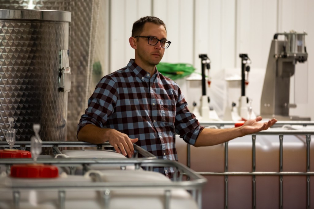 Nathan Hall, co-owner of Kennebec Cider Company stands in the brewing building while providing a tour of the facility. Hall explained the brewing process and methods of the company on Saturday prior to the start of the third annual Ciderfest on Saturday in Winthrop.