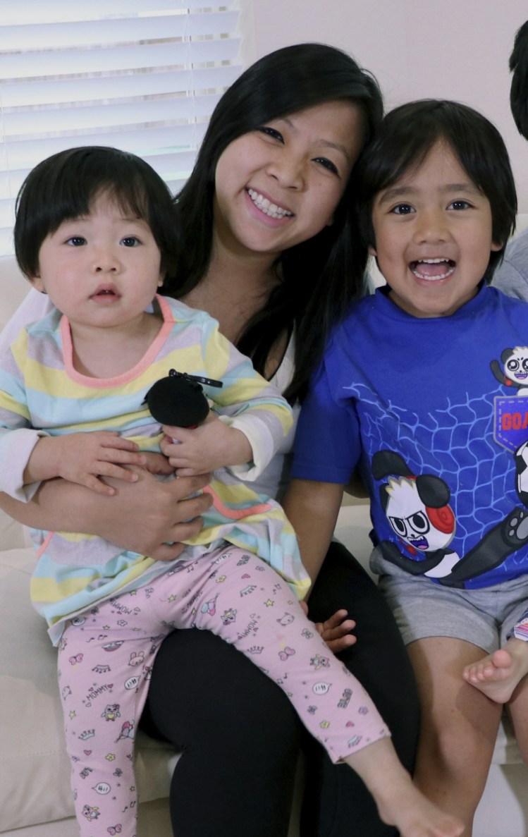 Seven-year-old Ryan, right, with his mother, Loann, and sister.